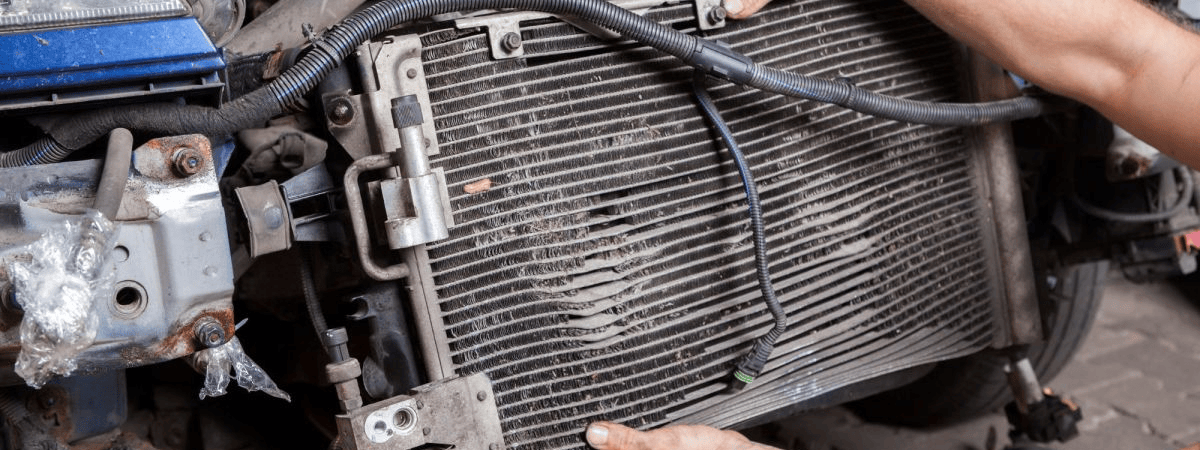Auto mechanic inspecting a radiator